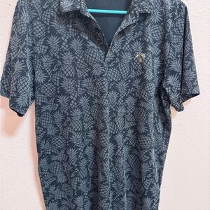 Travis Mathew Black Pineapple-Print Polo Shirt with Subtle Gray Motif